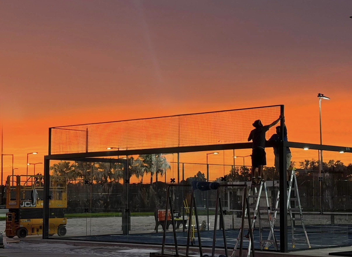 Off The Glass crew installing a padel court at sunset, Tampa, Florida